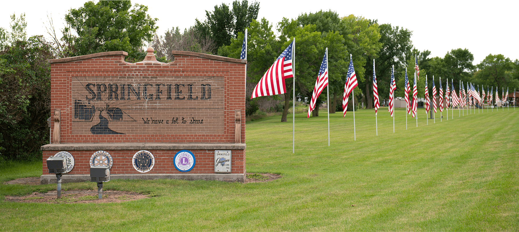 Springfield, mn city departments sign on green grass