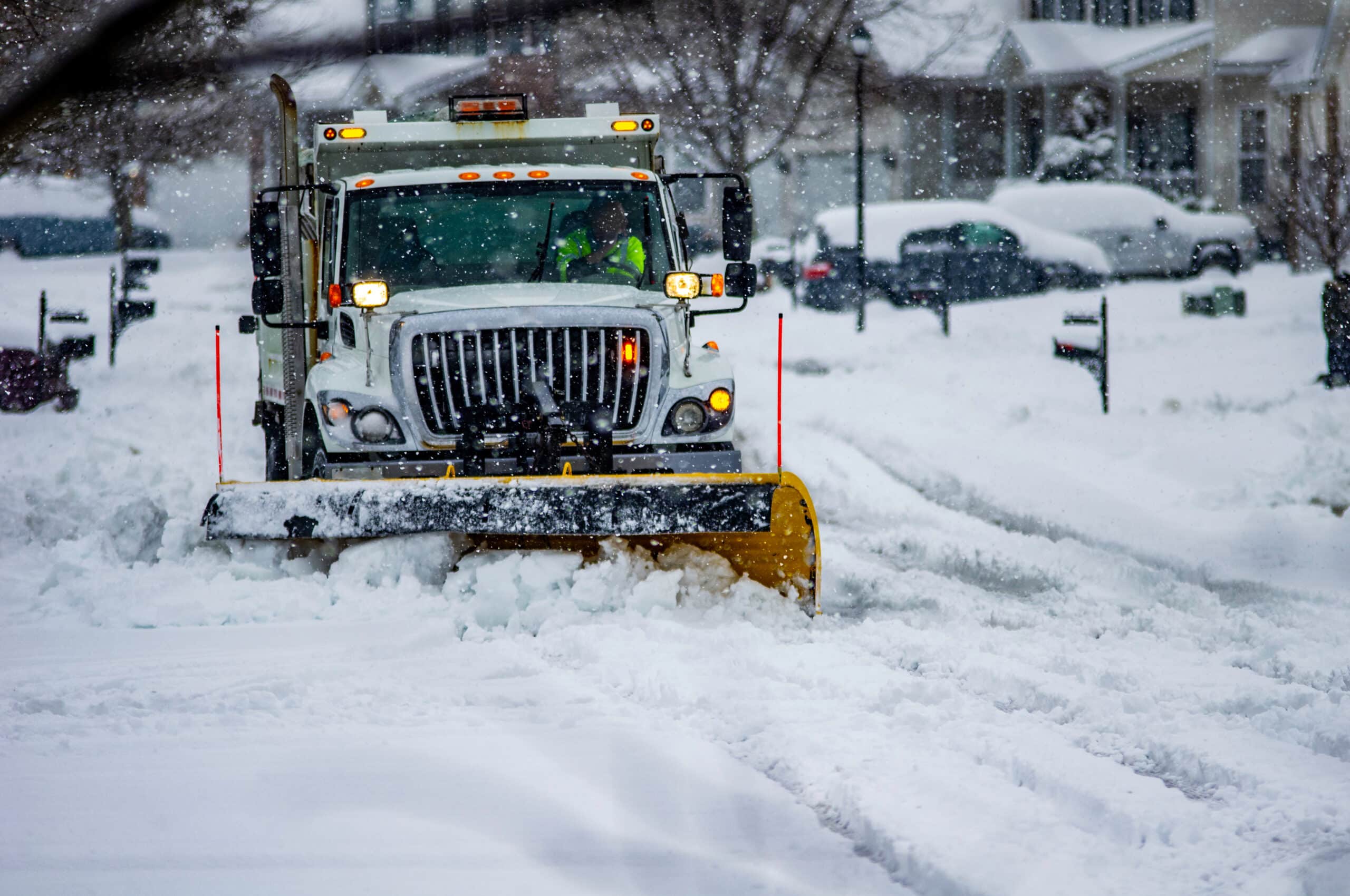 snow plow blade clearing streets