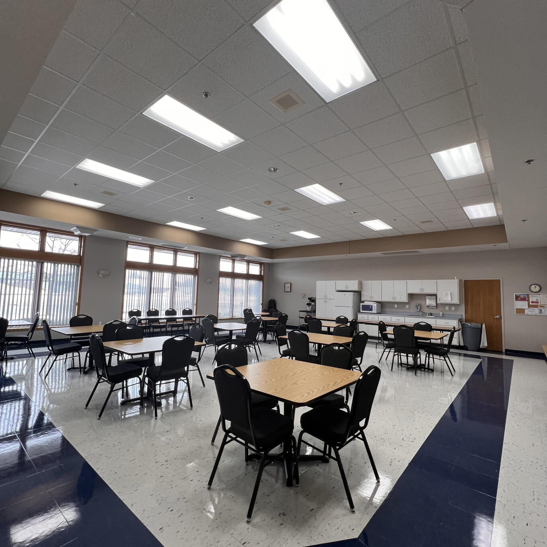 multi purpose room with tables and chairs