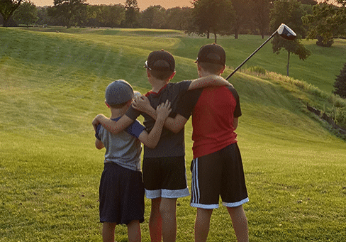 Boys playing golf on the springfield golf course