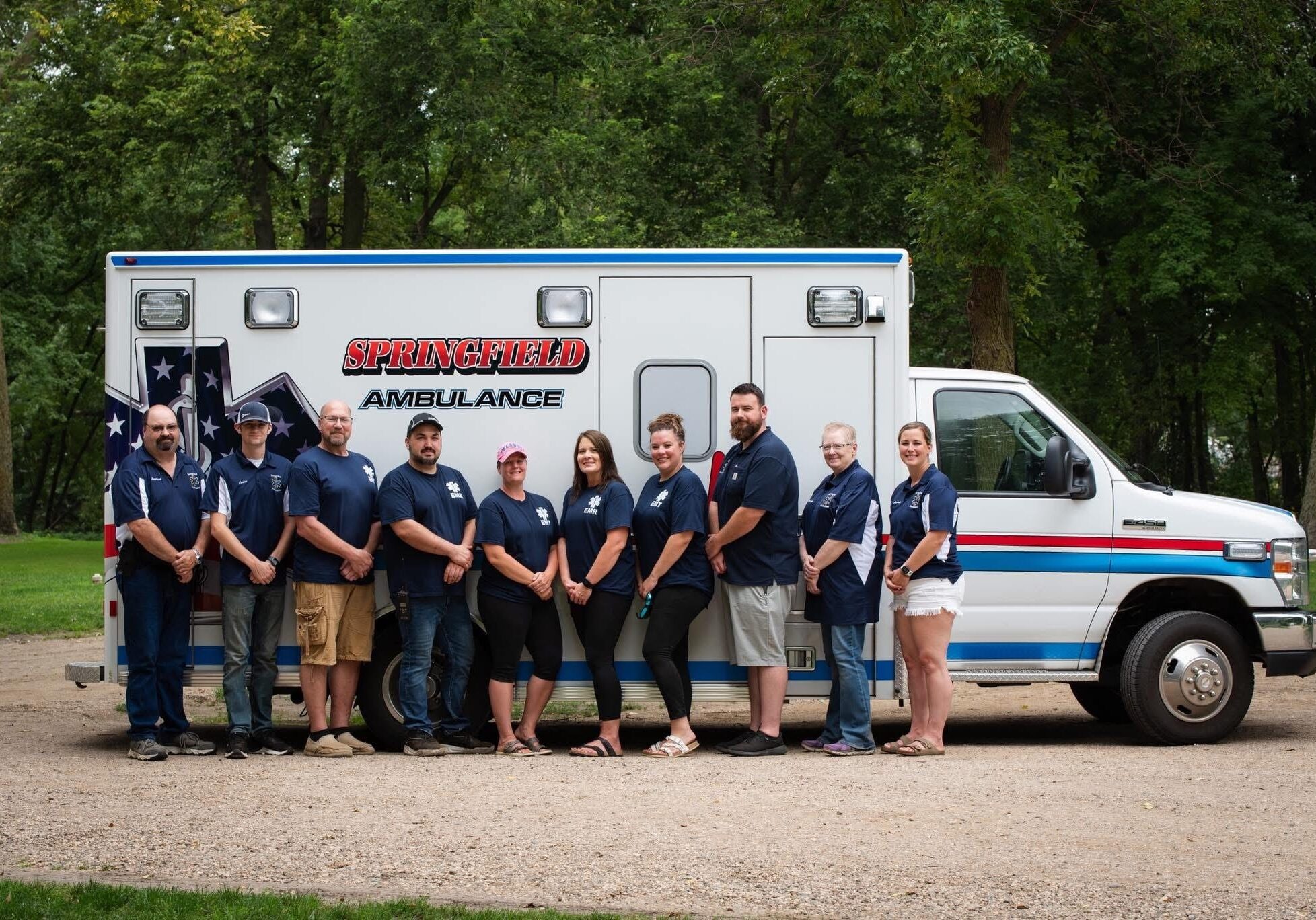 springfield mn ambulance team members in front of an ambulance